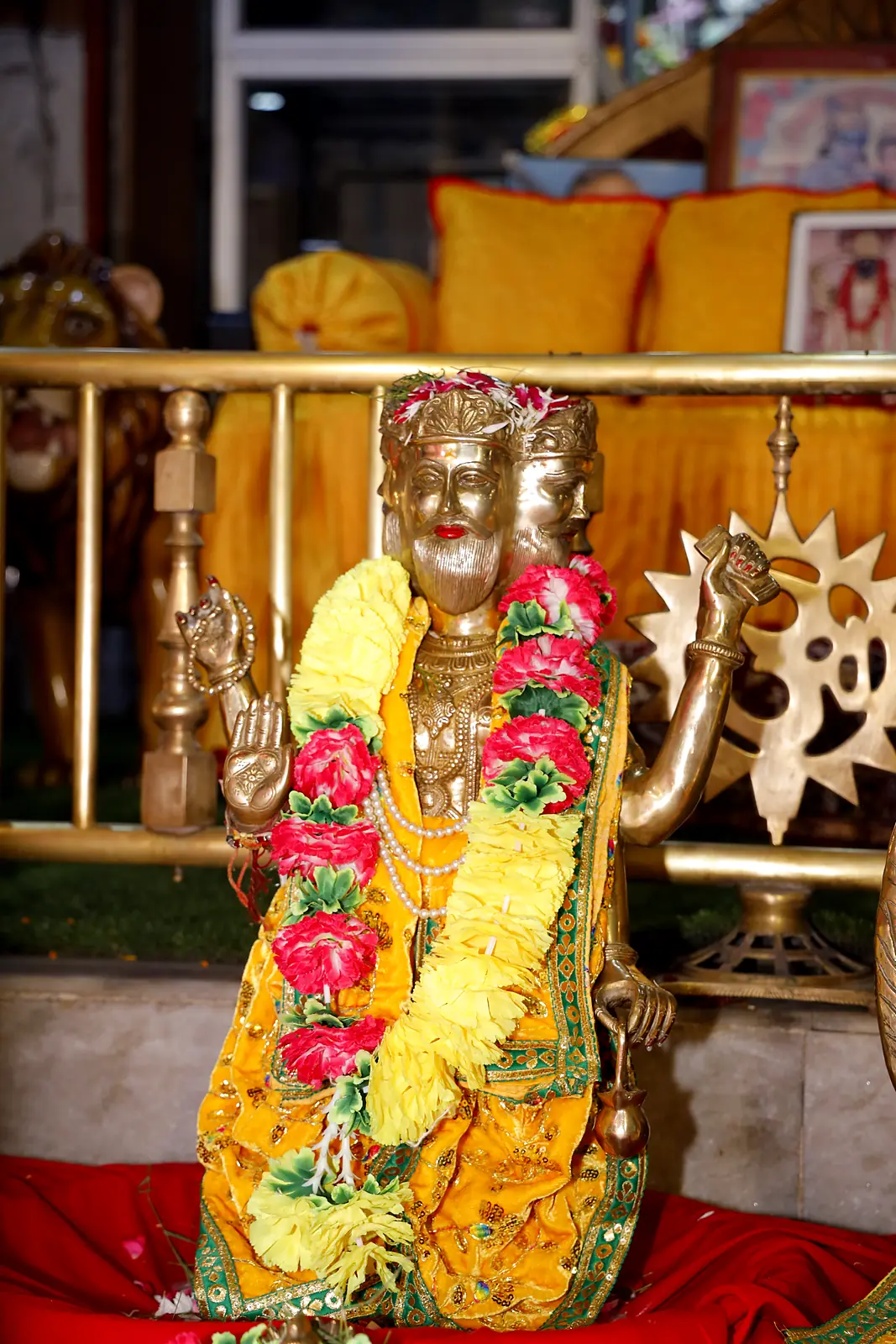 Utsav murti of Lord Brahma in yellow vastra