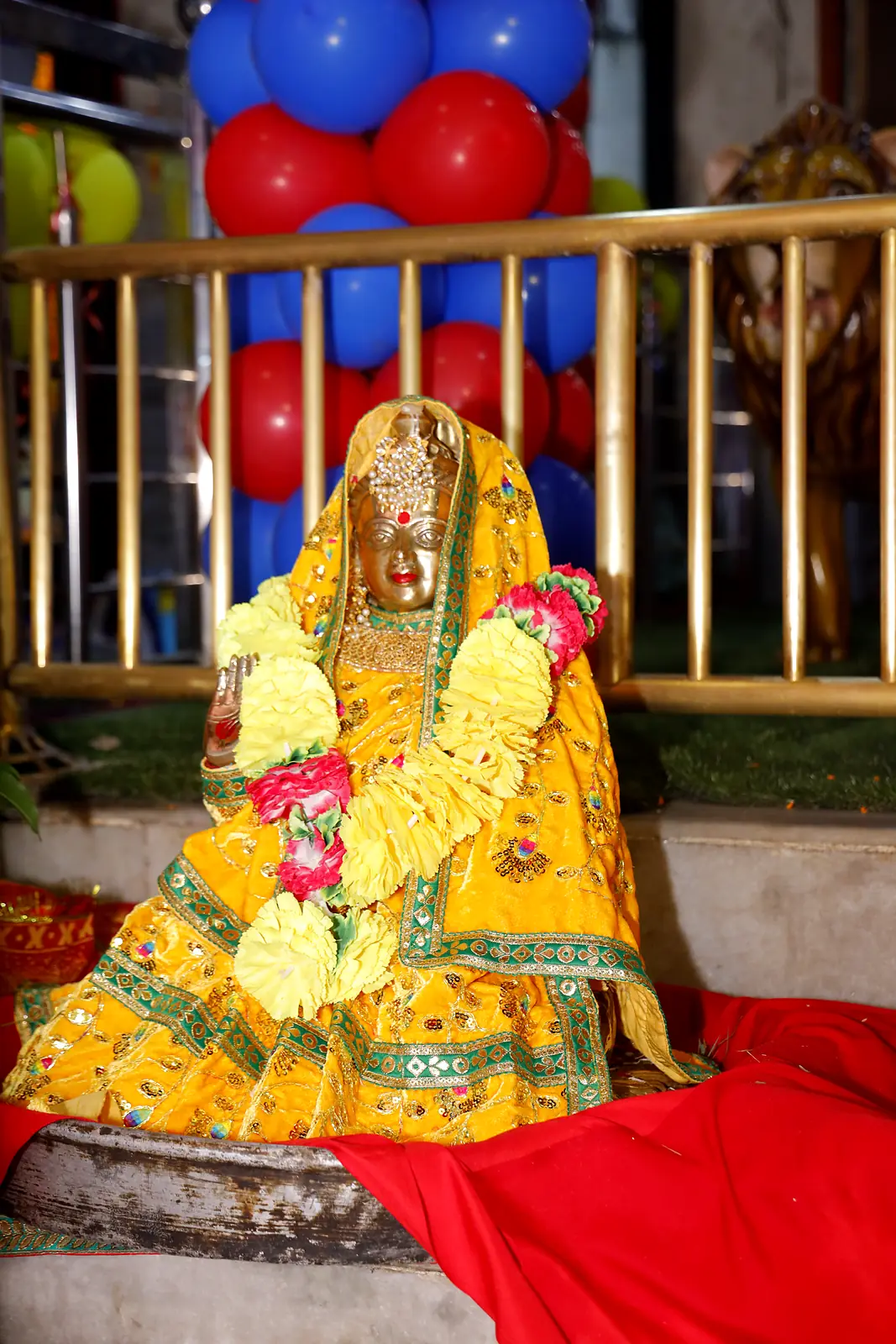 Devi murti in yellow vastra