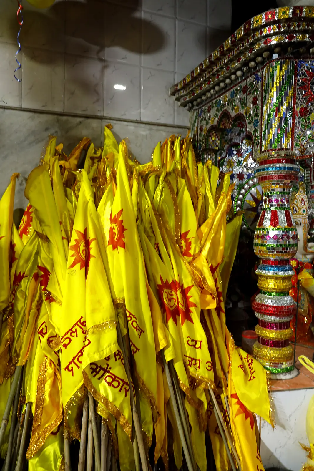 Yellow dhwajas prepared for the yatra