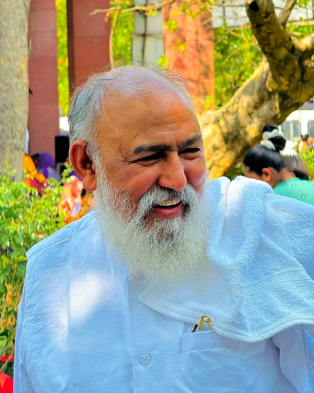 Pujya Guruji smiling in the temple garden