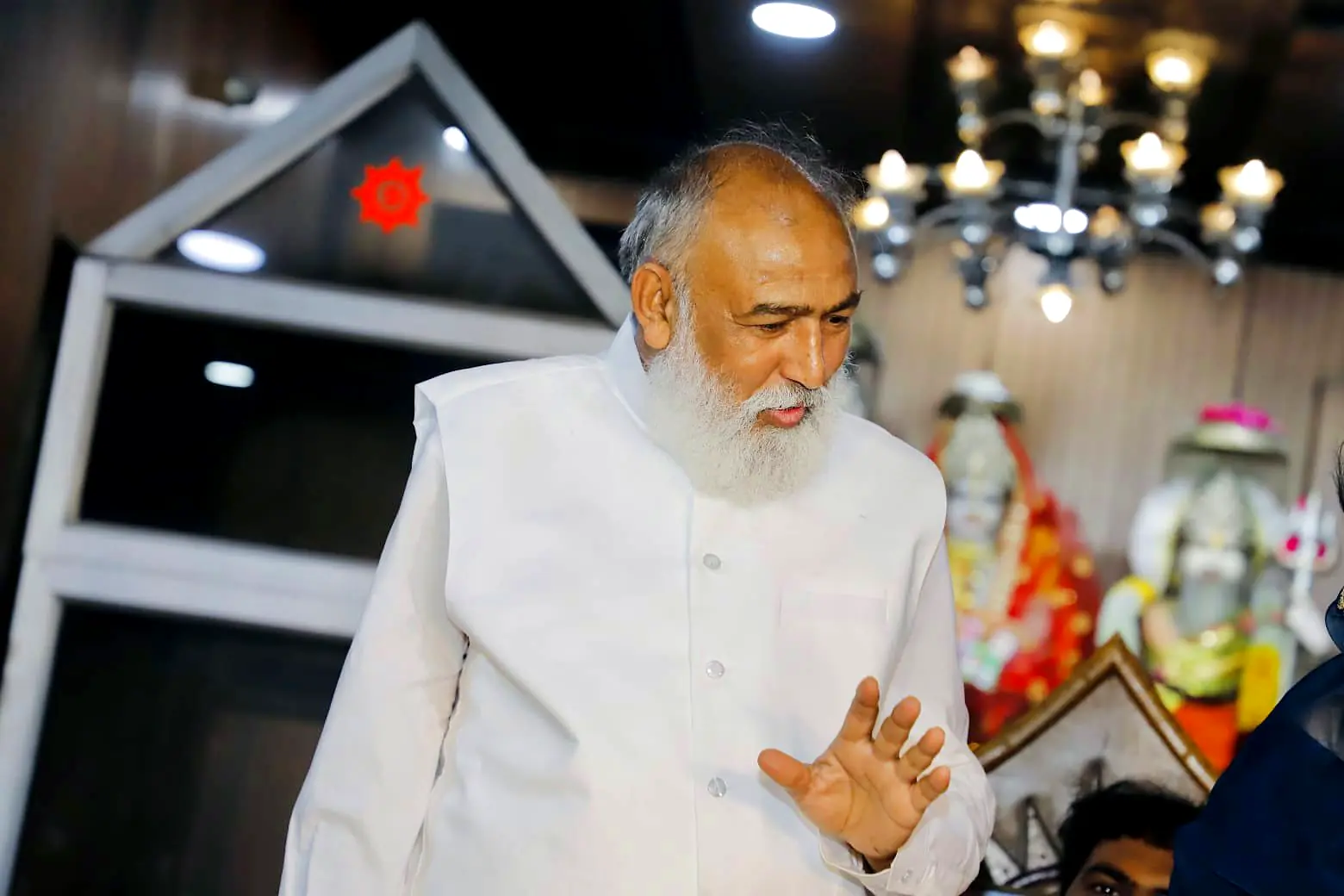 Guruji blessing devotees in the temple hall