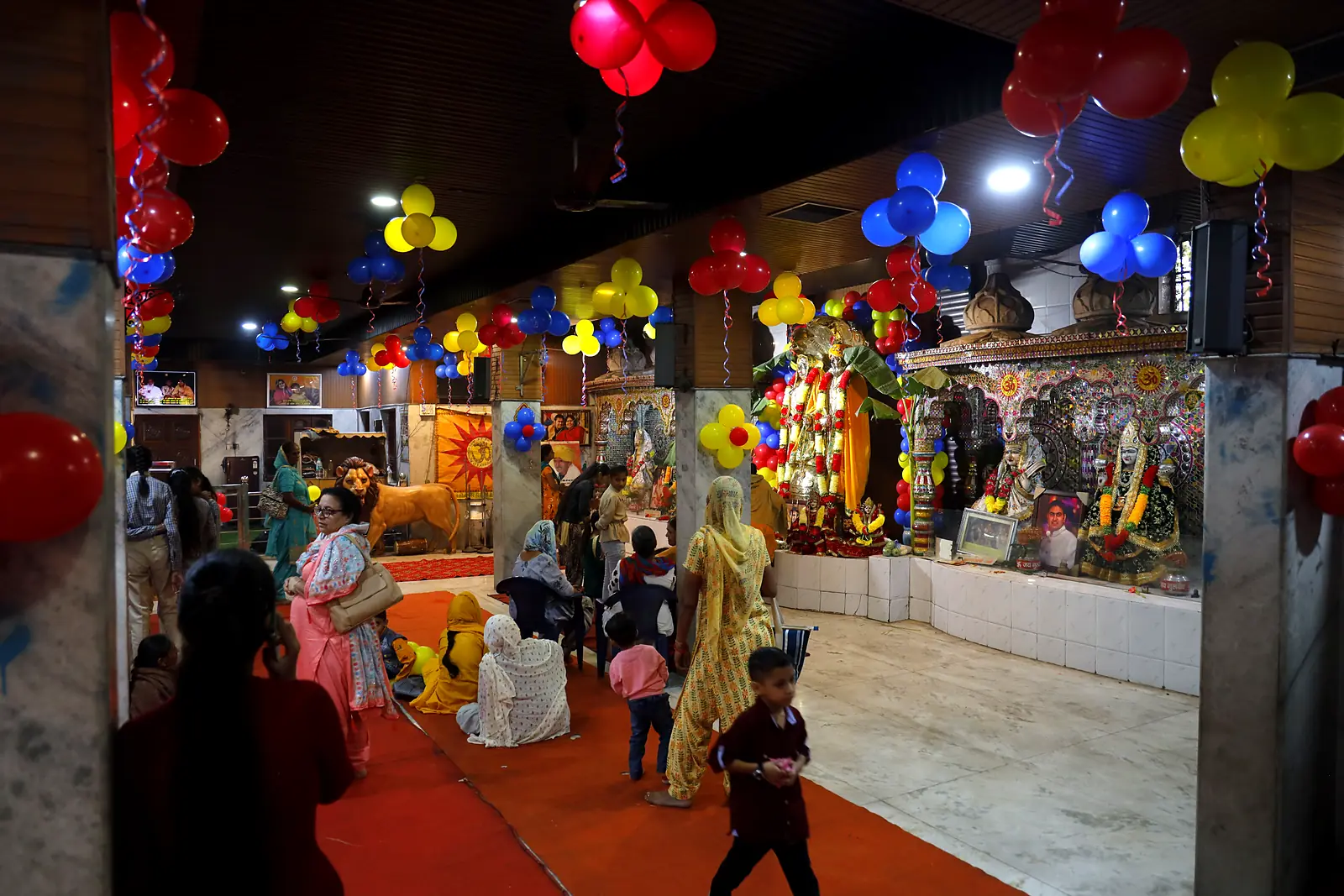 Devotees taking darshan in the hall