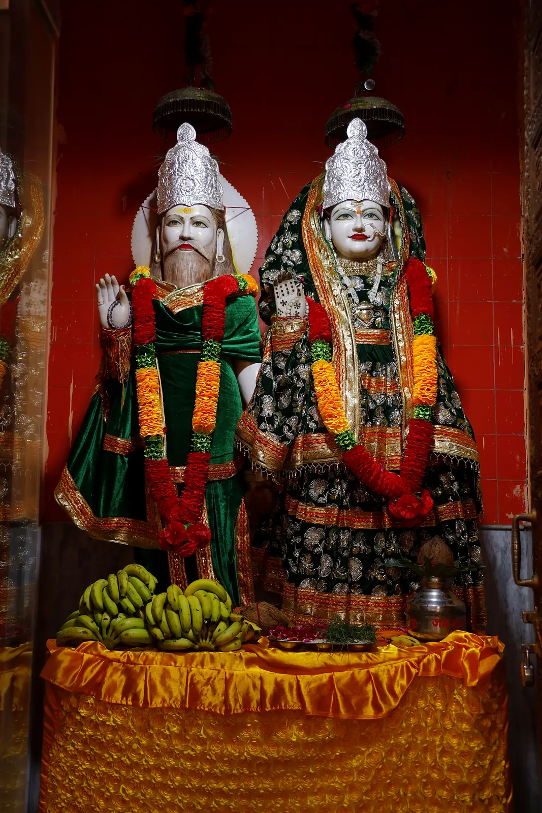 Divine couple murti in the side shrine