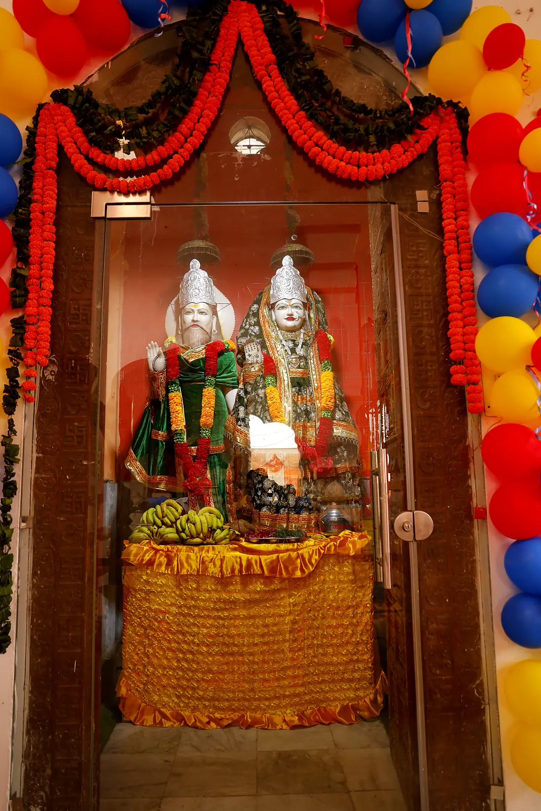 Divine couple in a decorated shrine