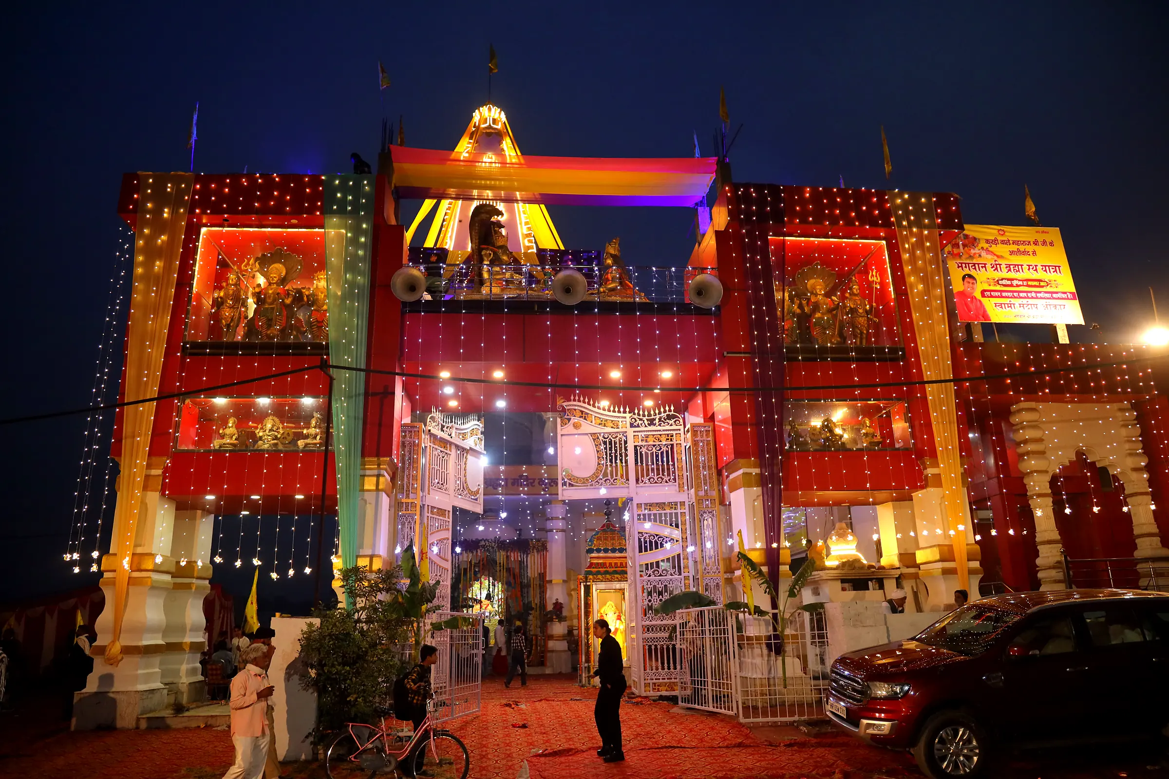 The temple lit up at night for the utsav
