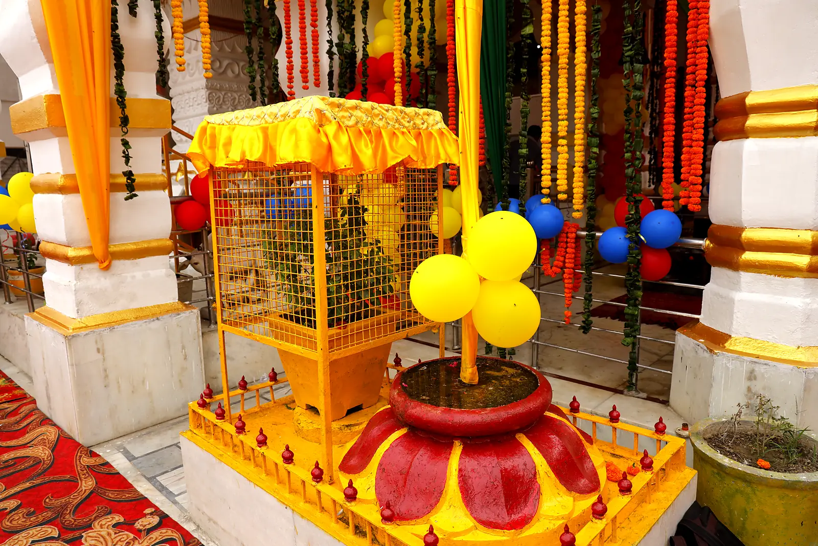 Decorated canopy and lotus base in the courtyard