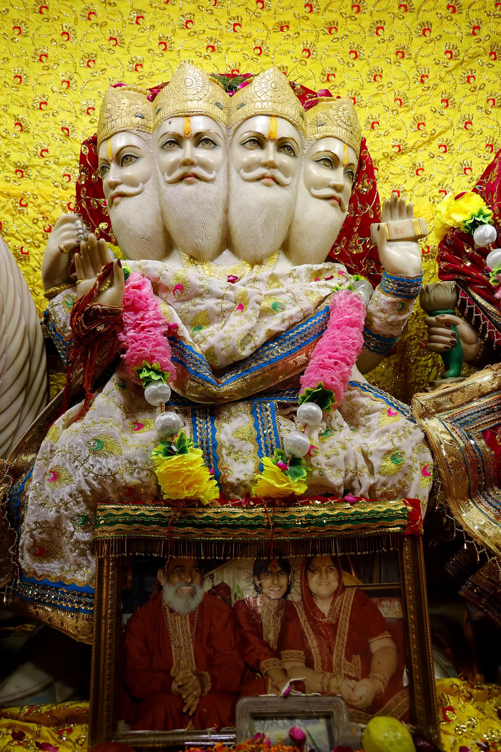 The four-faced marble murti of Lord Brahma
