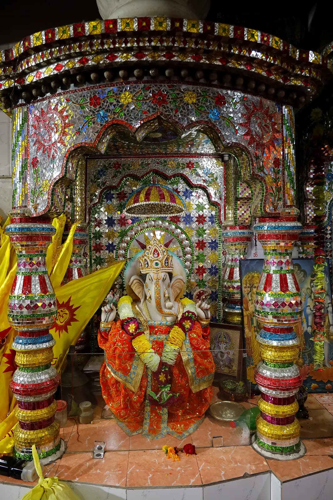 Shri Ganesh in the mirror-work shrine