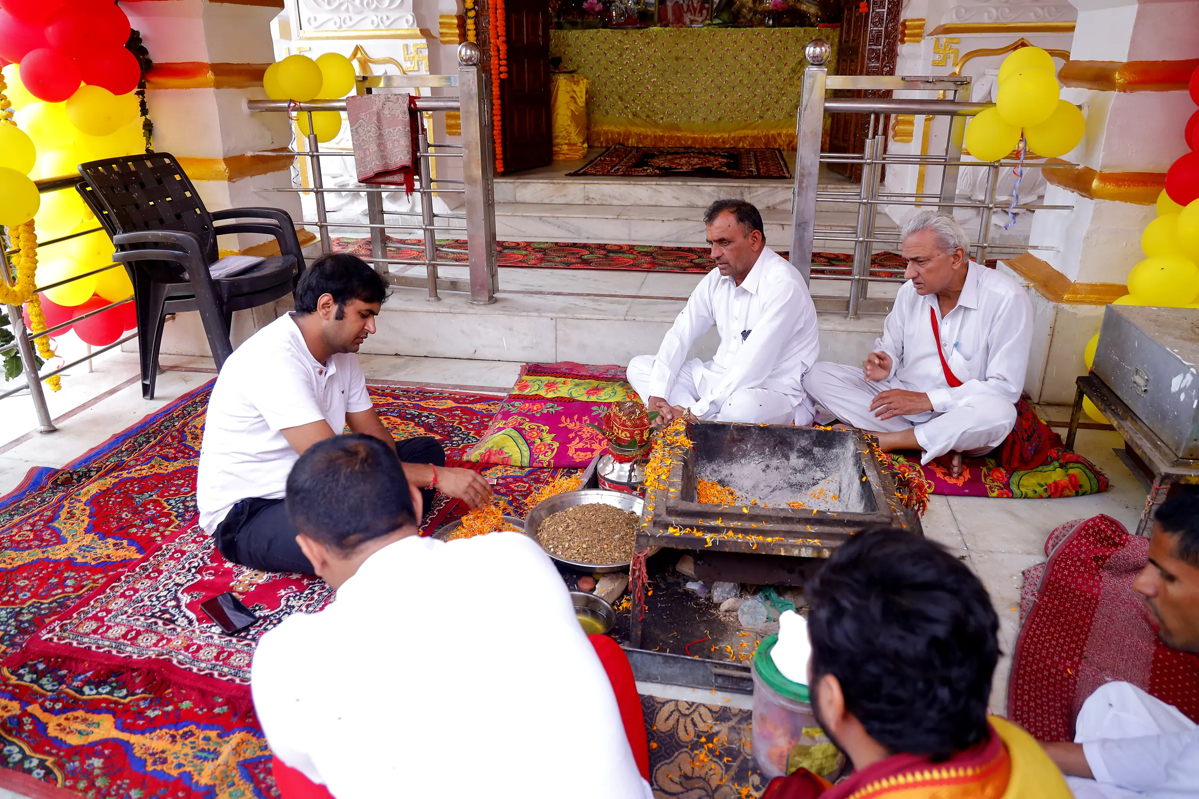 Devotees performing havan
