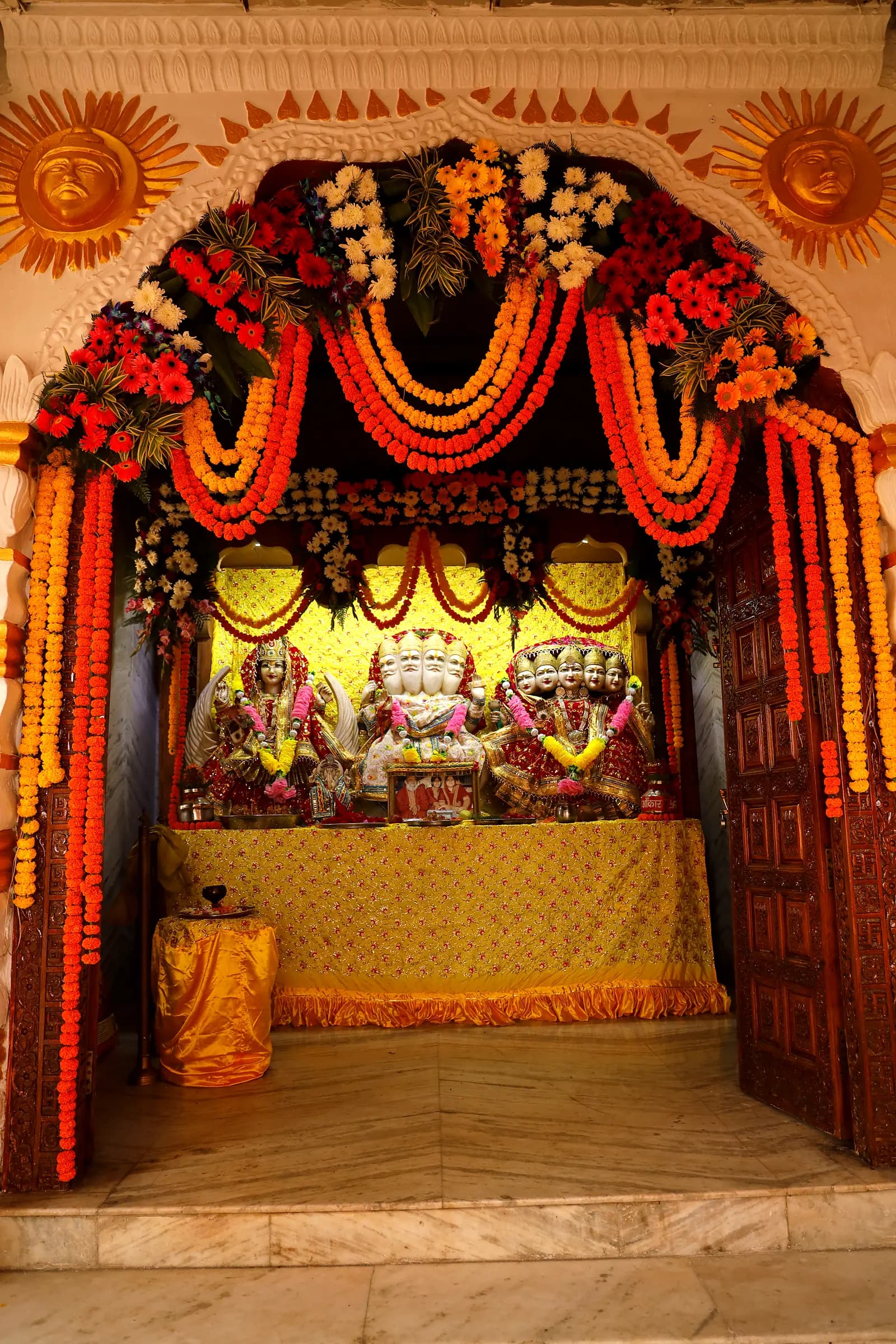 Flower-garlanded arch of the sanctum