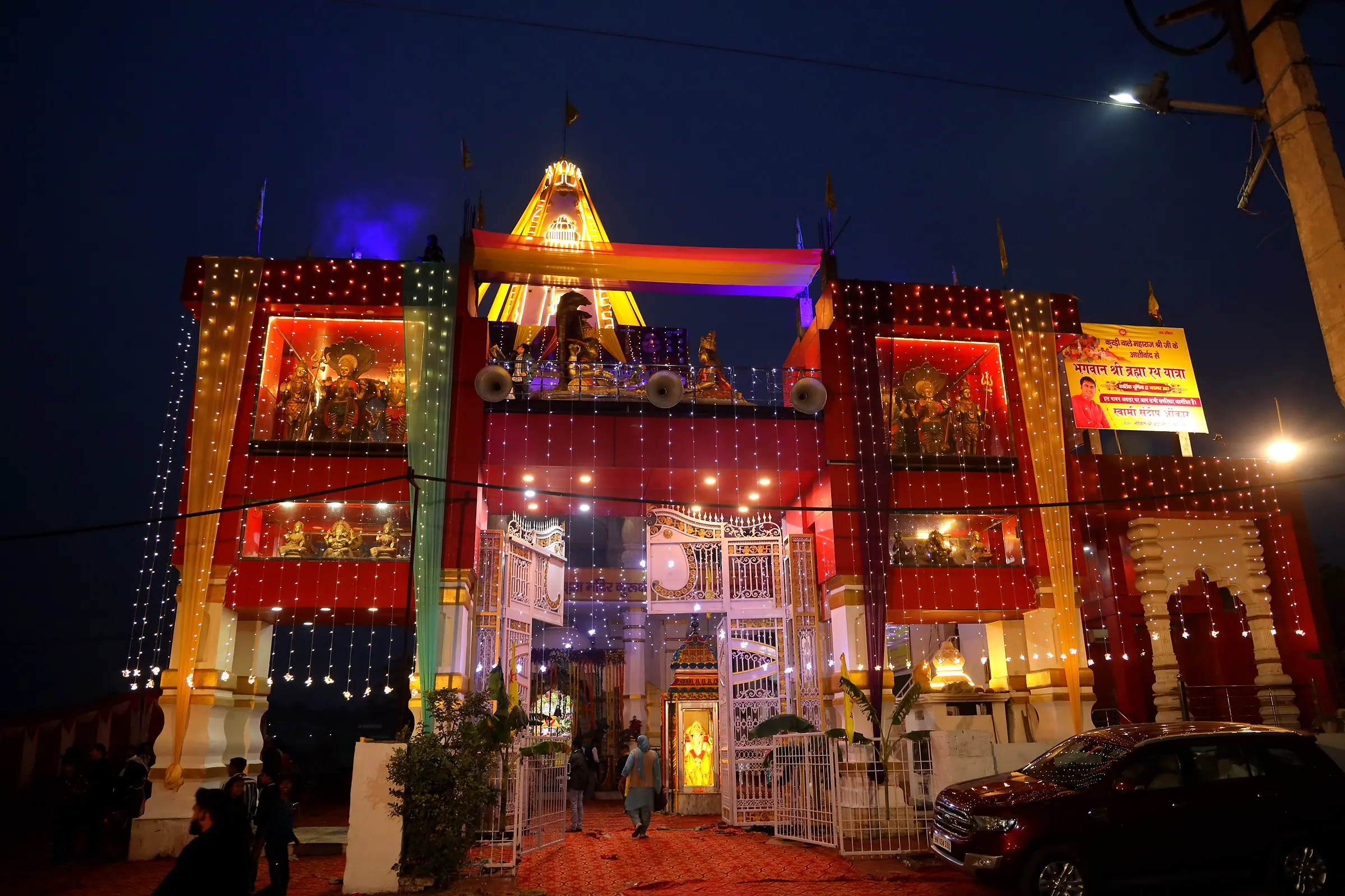 Illuminated gateway of the temple at night